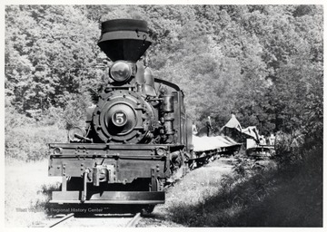 Shay No. 5 being loaded by a tractor. Cass Scenic R.R.; Cass, WV; John P. Killoran, Promotion Officer,WV State Parks,<br />Chas, WV 25305