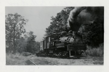 View of a Shay Engine traveling on tracks.
