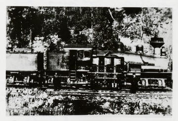 Side view of Shay train engine.  