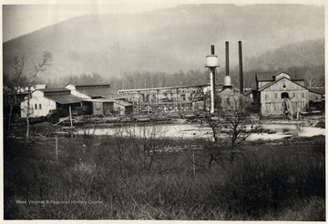 Lumber mill and pond. Three smoke stacks visible.  Greenbrier County.