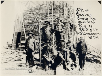 Seven men on the wrecked oil rig of H.E. Siger.  