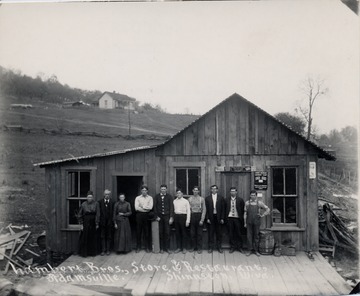 Group posed in front of building.