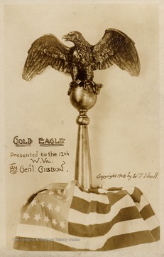 Gold eagle on top of an American flag.  Copyright 1908 by W.T. Hicoll.  