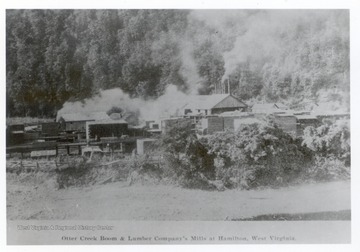 Otter Creek Boom and lumber mill with piles of lumber in Hamilton, W. Va.