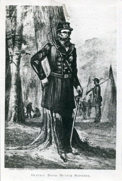 Portrait of General David Hunter Strother standing in the woods.