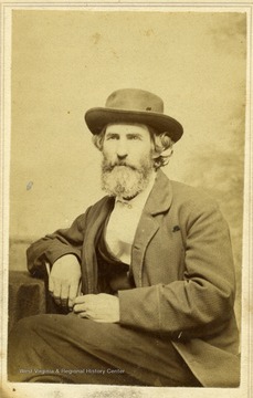 A portrait of an unidentified man with a hat on.