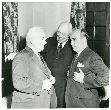 Three men talking during a Consolidation Coal Co. Inspection trip.