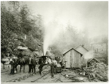 Men outside of the entrance to the mine at Fire Creek.
