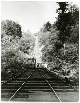 Women and children stand on the tracks below the New River Coal Company incline at Caperton, W. Va.