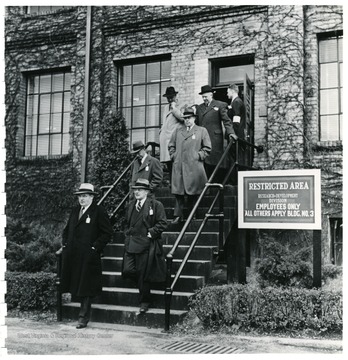 Coal officials leaving a restricted building of research and development during a Consolidation Coal Co. Inspection trip.