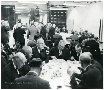 Coal officials eating dinner during a Consolidation Coal Co. Inspection trip.
