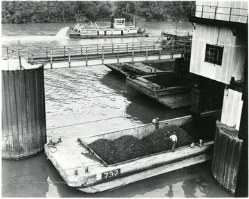 Coal barge on river being filled during a Consolidation Coal Co. Inspection trip.