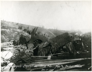 Crowd of people looking at the destroyed fan and boiler house after Monongah Mine explosion. 