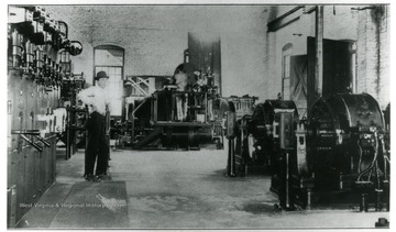 Man working in the Scarbro Mine Hoisting Room and Sub-Station, built in 1915-1916.