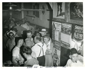Large crowd in Happy's Inn. 'James Timmis [sic], who was an organizer at Chicago, meat packers [sic].'