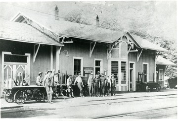 C&amp;O depot in Alderson W. Va. Men standing outside left to right: Moody Hokins, Harold Flack, Fred Patton, Floyd Thomas, Frank Bordurant, Agent T.L. Jamison, unknown, unknown, Freight Agent W.A. Hancock, J.C. Boggs (in doorway.)
