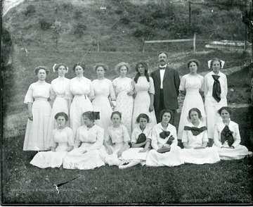 Teacher E. Chase Bare is standing with female Alleghany Collegiate Institute students. Dorothy Gish is second from left from Mr. Bare.
