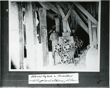 Employee is shown with milling equipment.