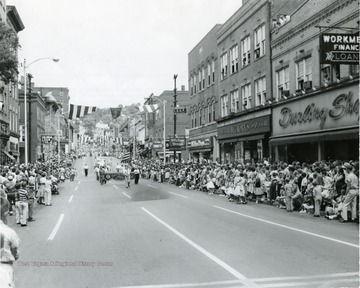 Crowds line the street to watch the Labor Day Parade. 