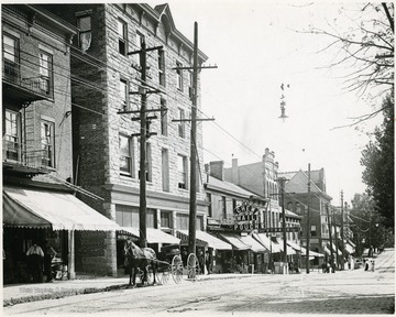 People going to stores on High Street, just above Walnut Street, Morgantown, W. Va.