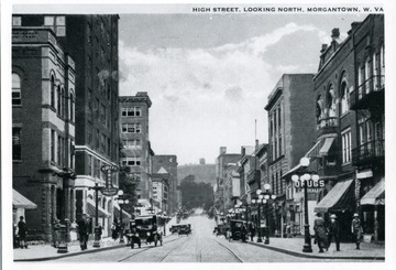 Postcard of High Street showing cars and people in Morgantown, West Virginia.