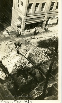 'Taken from the fourth floor of Strand Building when the street was well dug up which was at least 100 %.  Randal Gas Line 3 ft.; Deep Sewer 8 ft.;  Utilities Co. Water and Gas.  Rand gas Telephone Electric line 13 ft.