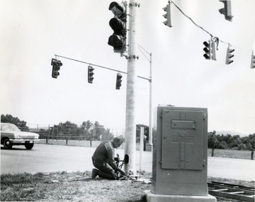 Installing traffic lights at the intersection of Patteson Drive and Monongahela Boulevard.