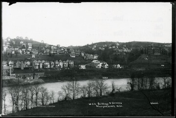 View across Monongahela River of WVU buildings and Seneca section of Morgantown W. Va. Woodburn Hall is at the far right.