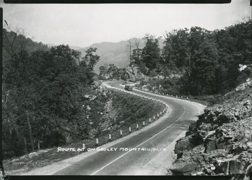 View of a car driving down Route 60 on Gauley Mountain.