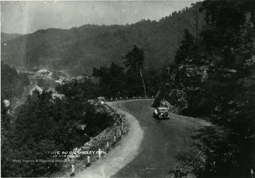 Car driving down Route 60 on Gauley Mountain.