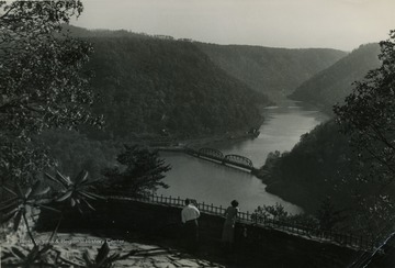 People enjoying the scenic view of the mountains and the river from Hawk's Nest in Fayette County.
