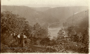 "Cheat River, looking up the river from the mountain side above the old Hilarity Club House.  So much of River as is shown is now flooded by the State Line Dam.  Taken about 1880 or shortly thereafter--Note the style of clothing and facial adornment.  Property of Jas. R. Moreland'