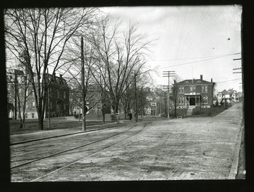 View of Martin Hall (left), Chitwood Hall-Science Hall (middle back), and Experimental Station (right). 'Reprinted from WVC negative by WVU Department of Radio, TV and Motion Pictures for WVU Centennial filmstrip.'