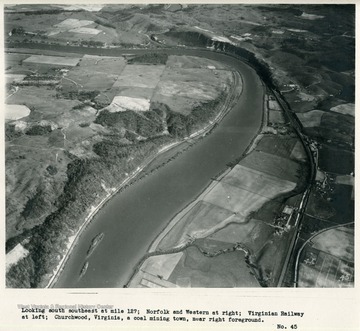 'Looking south at mile 127; Norfolk and Western at right; Virginian Railway at left; Churchwood, Virginia, a coal mining town, near right foreground.'