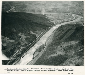 'Looking southeast at mile 99; the Narrows between East River Mountain (right)and Peters Mountain (left); town of Narrows, Virginia, in right background; camera pointed toward sun.'