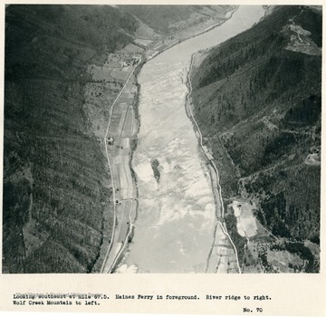 'Looking southeast at mile 67.5.  Haines Ferry in foreground.  River ridge to right.  Wolf Creek Mountain to left.'