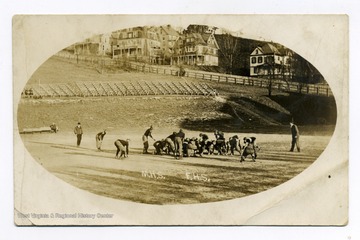 A game of Football Morgantown High School vs Fairmont High School near North High Street on West Virginia University's playing field.