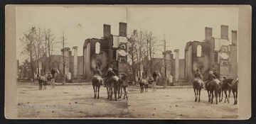 Stero card photograph of buildings in Chambersburg, Pennsylvania, burned by the Confederate Cavalry under General John Mc Causland of Mason County, West Virginia. Mc Causland's destructive raid was in reprisal for the burnings in the Shenandoah Valley by the Union troops.