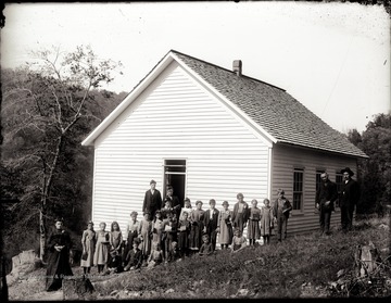 A portrait of school children and teachers taken just outside of the school building in the Helvetia, W. Va area.