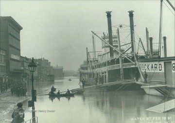 The "Ben Hur" tied up on Water Street during the flood of 1891. The steamboat packet sank in 1916 on the Mississippi river.