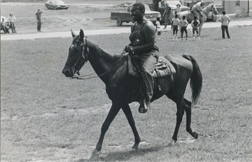 Ed Cabbell riding a horse during the John Henry Folk Festival in Charleston, W.Va.