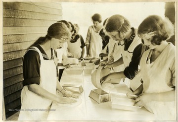"Better Bread" is the object in the minds of the busy girls pictured. At Jackson's Mill they were taught by experts just how it should be made.