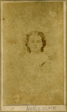 A carte de visite of a young girl in curls.