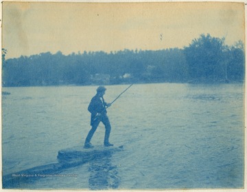 Unidentified man pulls in a catch.