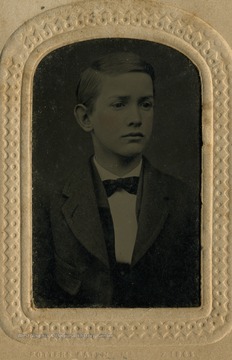 Portrait of young boy, possible the son of Nathaniel and Matilda Bailee. The album holding this tintype has the name card of Charles R. Bailee attached on the inside cover.