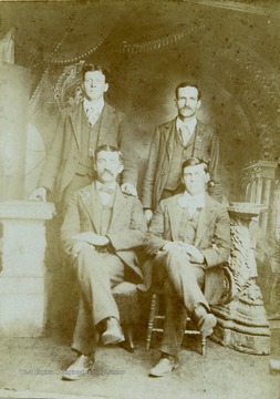 Information included with photograph, "Left to Right -Ira Summers, John A. Huffman, John A. Huffman was a brother of Francis Marion and Nelson N. Huffman." Others persons are not identified.