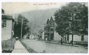Postcard photograph of dirt paved street in town of Clay, county seat of Clay County.