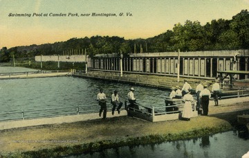 Several people sit on the railing around the pool at Camden Park. Published by J.C. McCrorey &amp; Company. (From postcard collection legacy system.)