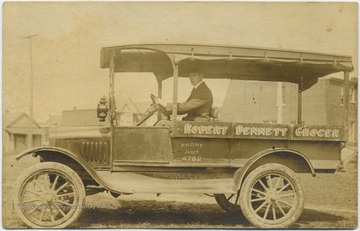 Bennett driving his car through Morgantown, W. Va.