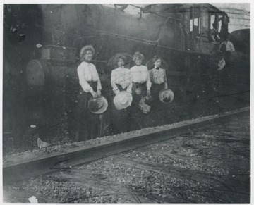Mrs. R.O. Murrell pictured second from left. Others are unidentified. 